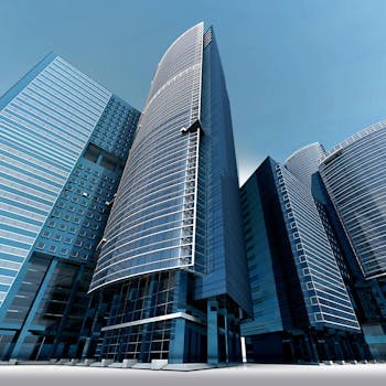 Futuristic urban skyscrapers with glass facades reflecting a vibrant blue sky.